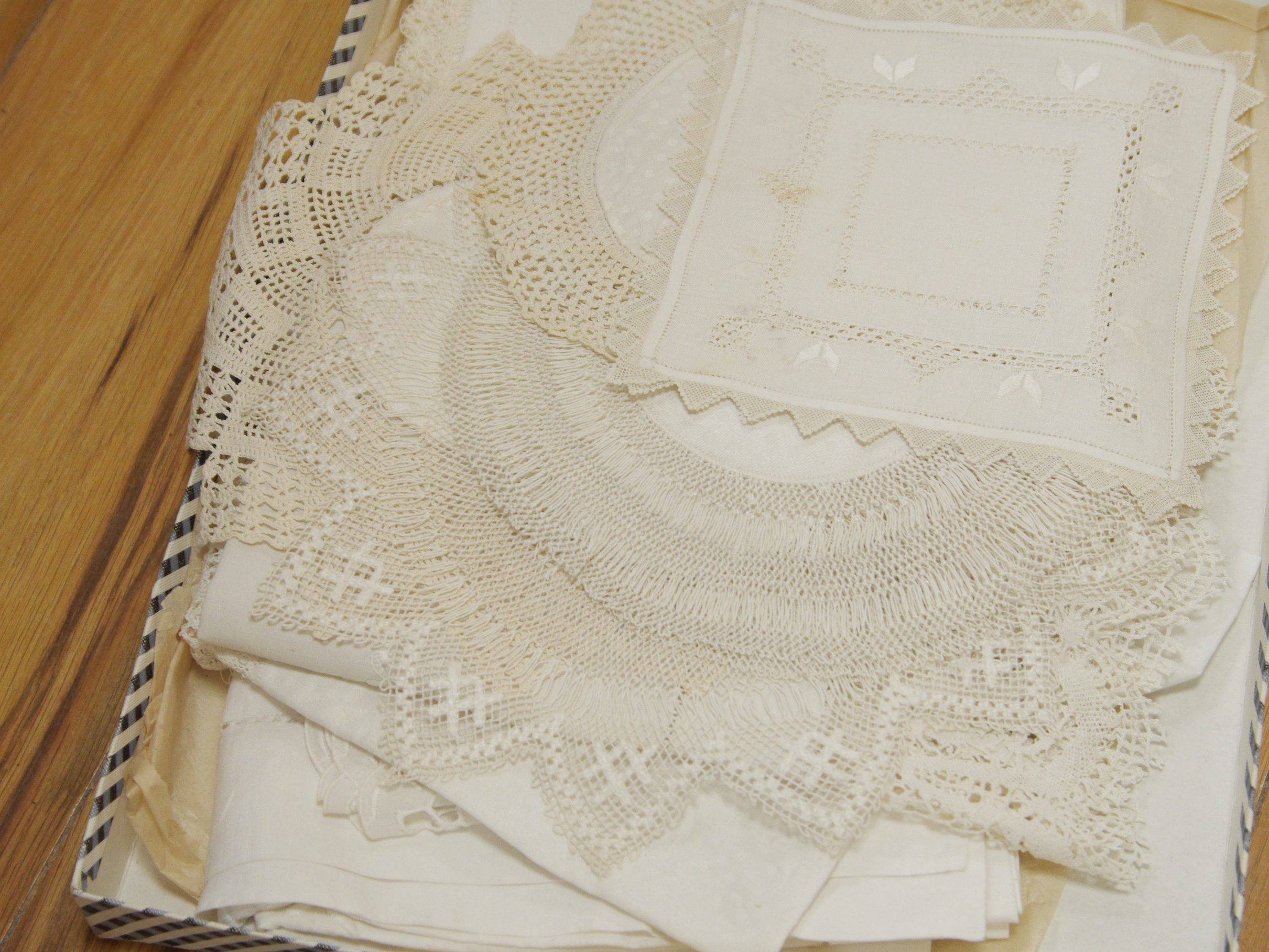 A collection of Edwardian handmade crochet, needle lace, tatting and drawn thread worked table cloths and table mats etc. Condition - good